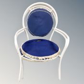 A pair of tubular metal stacking garden armchairs