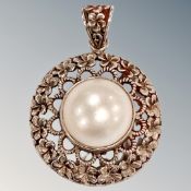A silver mother of pearl pendant