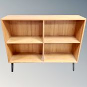 A set of 20th century teak open bookshelves on raised legs