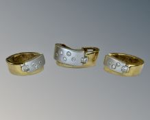 A pair of 18ct two tone gold diamond set earrings, together with matching pendant.
