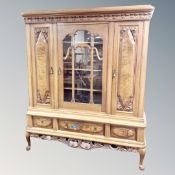 An early 20th century Scandinavian oak and walnut triple door sideboard