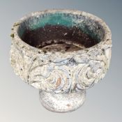 A classical style concrete garden planter on stand