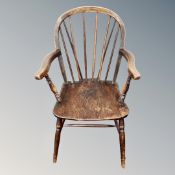 A 19th century elm and beech kitchen armchair