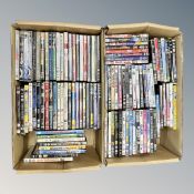 Two boxes containing approximately 100 dvds