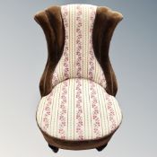 An early 20th century upholstered nursing chair