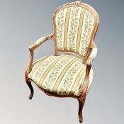 A carved beech framed salon armchair