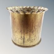 A large brass ammunition shell,
