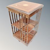 A Victorian style inlaid mahogany revolving bookstand