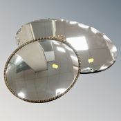 A circular brass framed convex mirror and an un-framed 1930's mirror