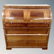 A 19th century mahogany barrel front bureau