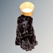 A vintage mink fur coat and a hat box