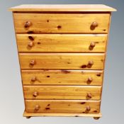 A contemporary pine six drawer chest