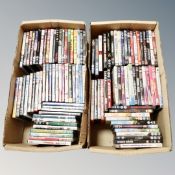 Two boxes containing approximately 100 dvds