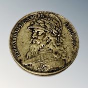 An antique medallion depicting Edward III