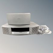 A Bose Wave music system together with a further Bose DAB module with leads