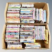 Two boxes containing approximately 100 dvds
