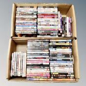 Two boxes containing approximately 100 dvds