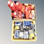 Two boxes of car parts including Bosch spark plugs, steering and suspension parts,