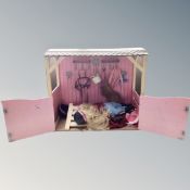 Two toy horse stables,