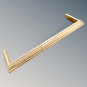 A vintage brass fire curb