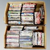 Two boxes containing approximately 100 dvds