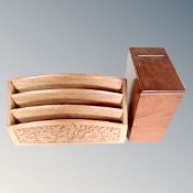 An early 20th century mahogany lined tea caddy together with a carved letter rack