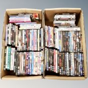 Two boxes containing approximately 100 dvds