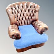 A Chesterfield brown buttoned leather armchair CONDITION REPORT: Cushion odd.