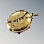 A Victorian yellow metal locket CONDITION REPORT: 9.