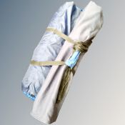 Four person dome tent in carry bag and a folding chair