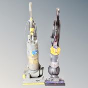 A Dyson DC40 ball vacuum together with a Dyson 04 vacuum