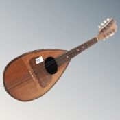 A Guiseppe Casini eight string bowl back mandolin