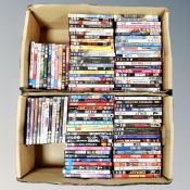 Two boxes containing approximately 100 DVD's