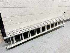 An aluminium triple extension ladder,