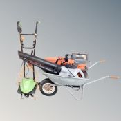 A wheel barrow together with a flymo garden vacuum,