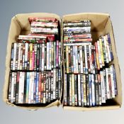 Two boxes containing approximately 100 DVD's