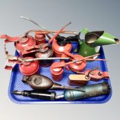 A tray of vintage oil cans