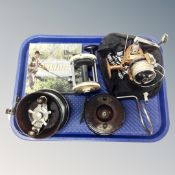 A tray of four fishing reels, Garcia Mitchel 600, Shakespeare 2710, vintage and Bakelite example,