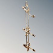 A gilt antique metal coat rack