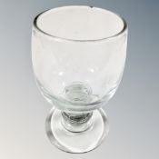 A hand made mouth blown cupped bowl rummer with knopped squat stem