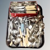 A tray of plated and stainless steel flatware