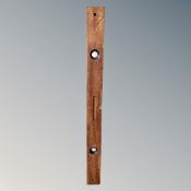 A vintage wooden spirit level
