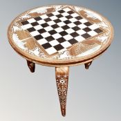 An Indian bone-inlaid chessboard occasional table on elephant legs