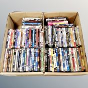 Two boxes containing approximately 100 DVD's