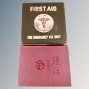 A 20th century US Army first aid kit in metal case together with the complete first aid outfit book