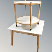 A Danish two-tone square coffee table together with two-tier trolley