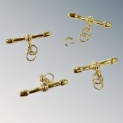Four gold plated T-bars