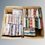 Two boxes containing approximately 100 DVD's