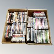 Two boxes containing approximately 100 DVD's