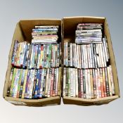 Two boxes containing approximately 100 DVD's